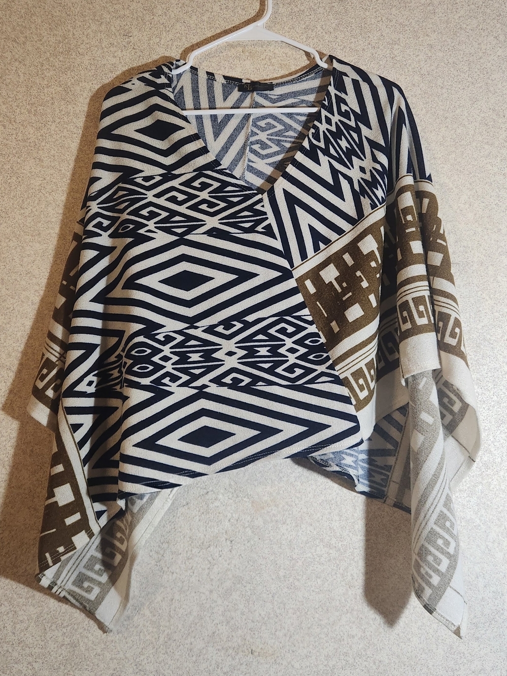 Geometric V-Neck Poncho Sweater in Black and Cream with Brown Accents